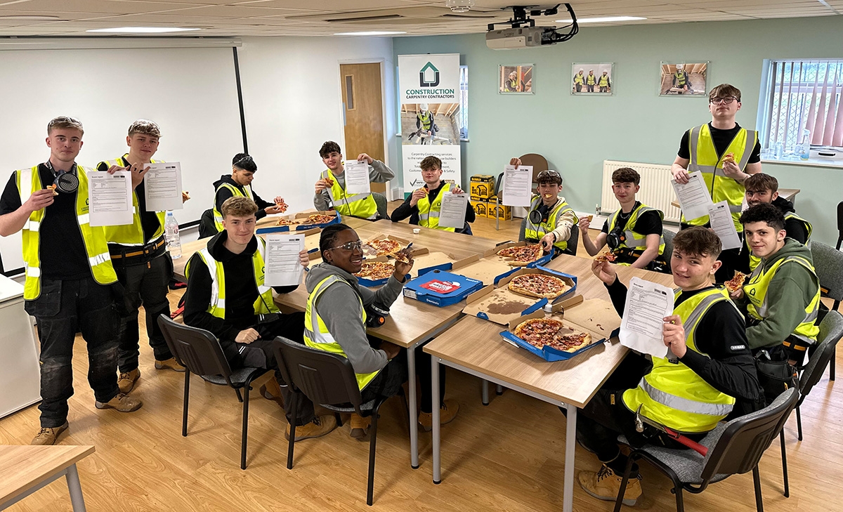 LJ Construction site ready course wrapping up with certificates and pizza for the 14 students